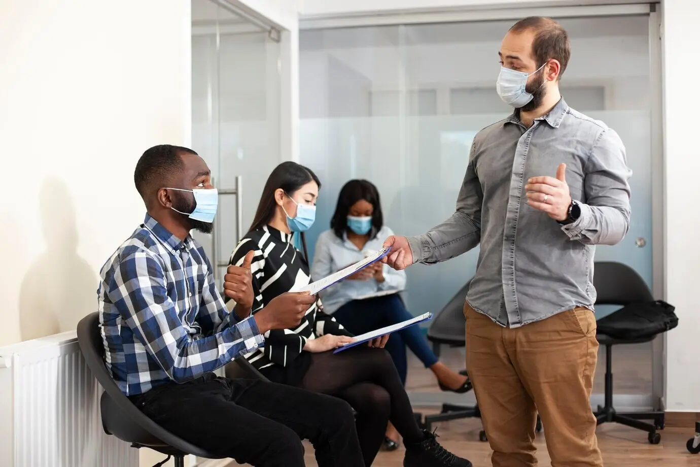 Caucasian manager gathering CV resumes